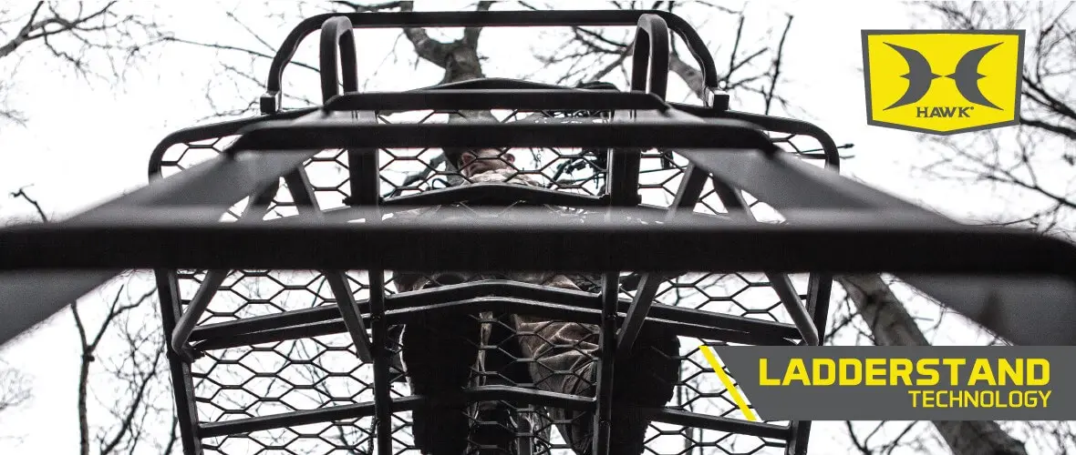 Looking up at a metal ladderstand in a forest with bare trees, showing a person climbing. Bright, industrial feel. Text reads "Ladderstand Technology."