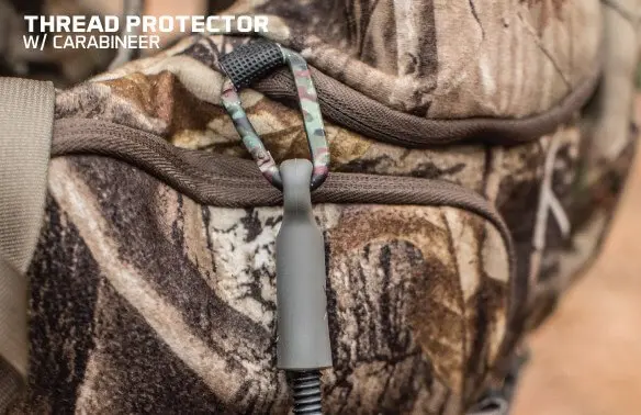 Camouflage-patterned thread protector with a carabiner attached to a matching camo bag. Text "Thread Protector w/ Carabiner" in the top left corner.